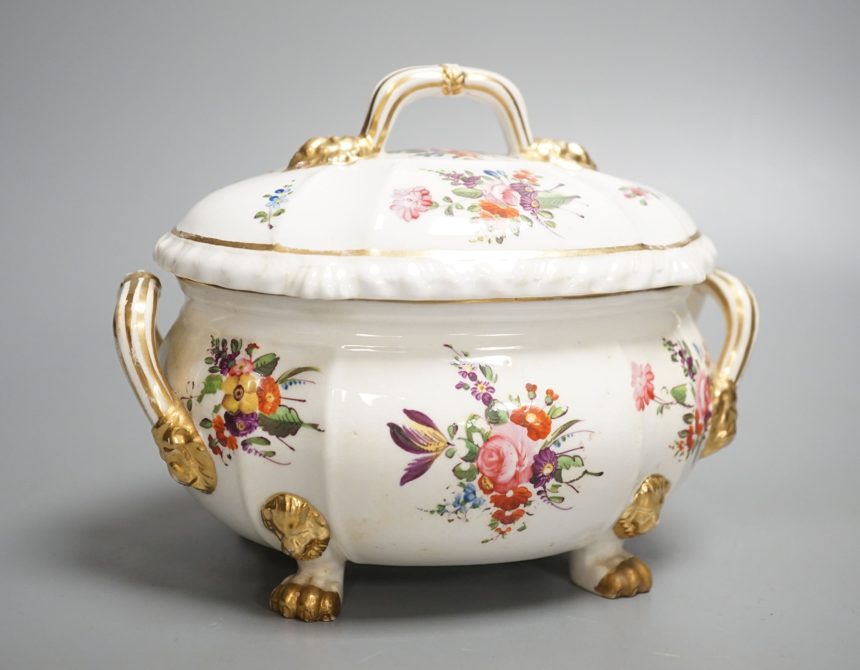 A Derby tureen and cover, early 19th century, on four feet with lion head masks painted with flowers, red mark, overall height 13.5cm